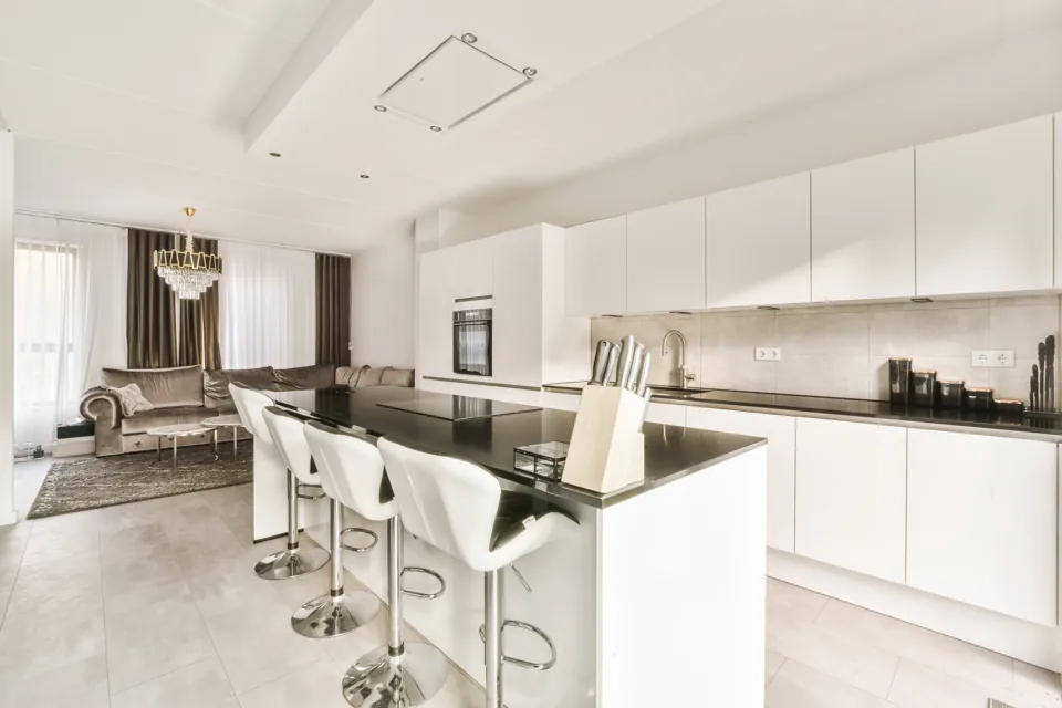Modern kitchen with a large island and light cabinetry